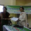 Getting the certificate of appreciation by Dr Divya,Joint Sec of IHMA,Blore